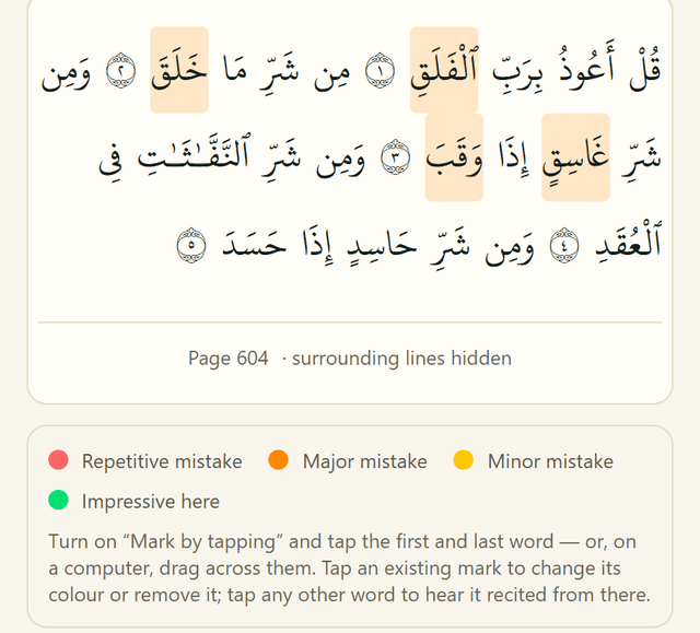 A page of the Mushaf with individual words marked in red and yellow by the teacher